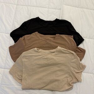 SKIMS Short Sleeve Tees - Black, Brown, and Tan